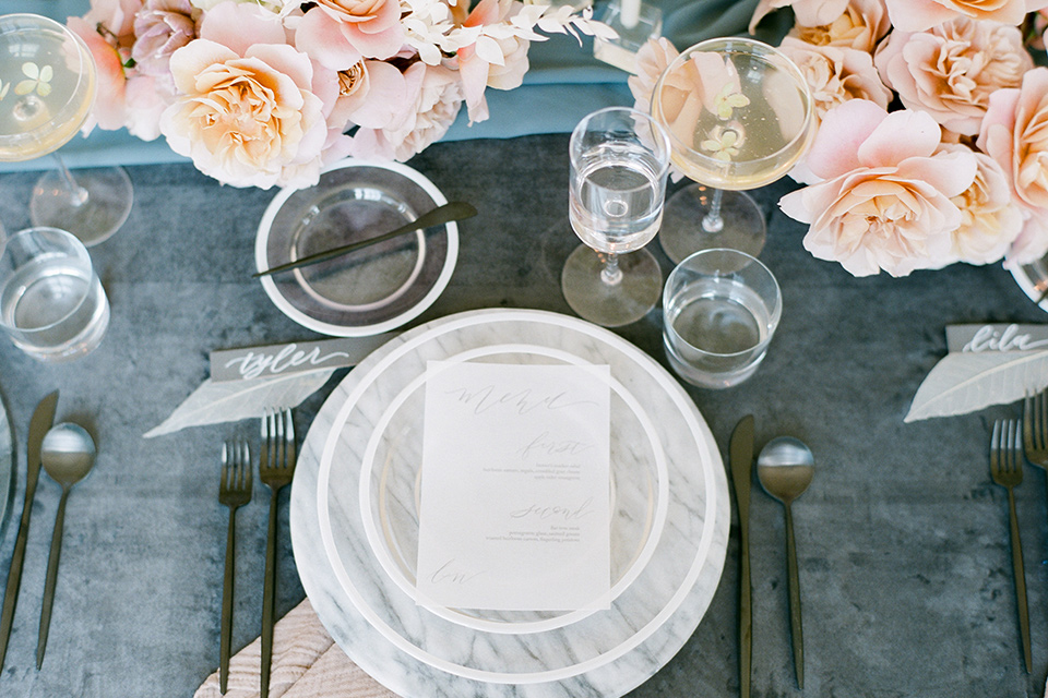  dusty blue linens and white and gold flatware