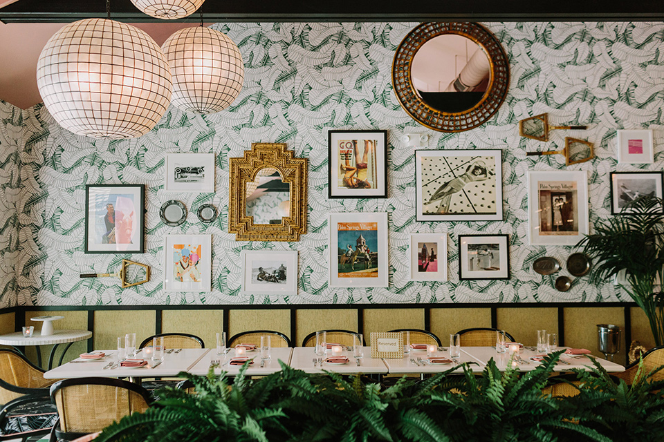  eclectic venue setting with fun wallpaper and art on the walls