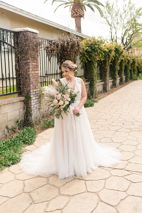 bride in a lace gown with a high neckline 
