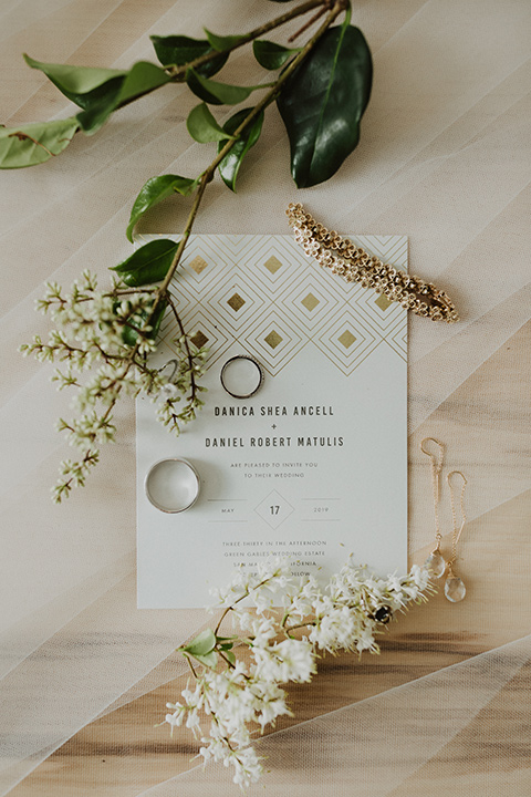  white invitations with rings 