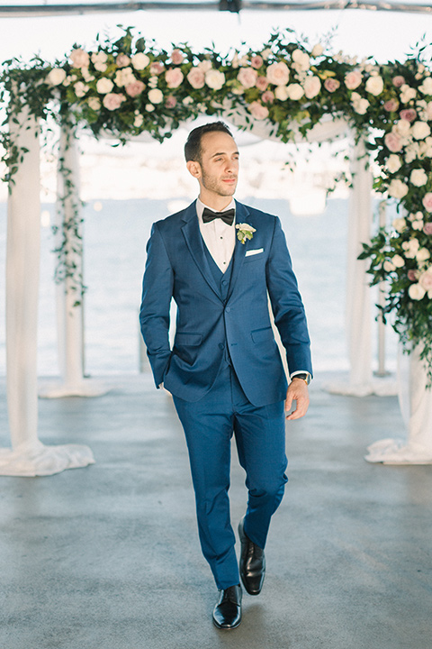  cobalt blue suit with a black bow tie