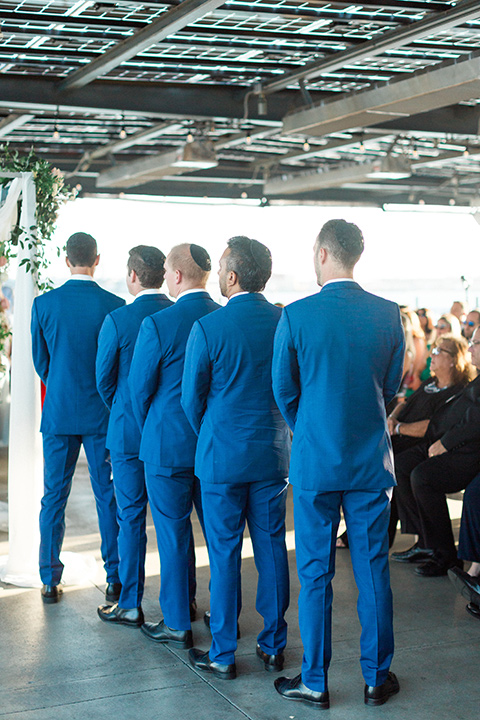  groomsmen in cobalt suits at the ceremony