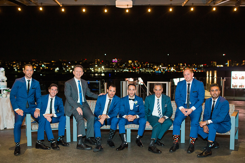  groom and groomsmen in cobalt blue suits with black bow and long ties