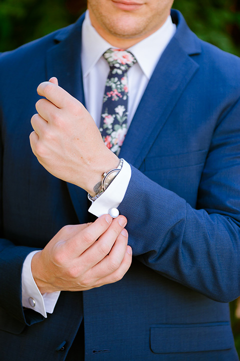  groom in a cobalt blue suit with a blue floral long tie