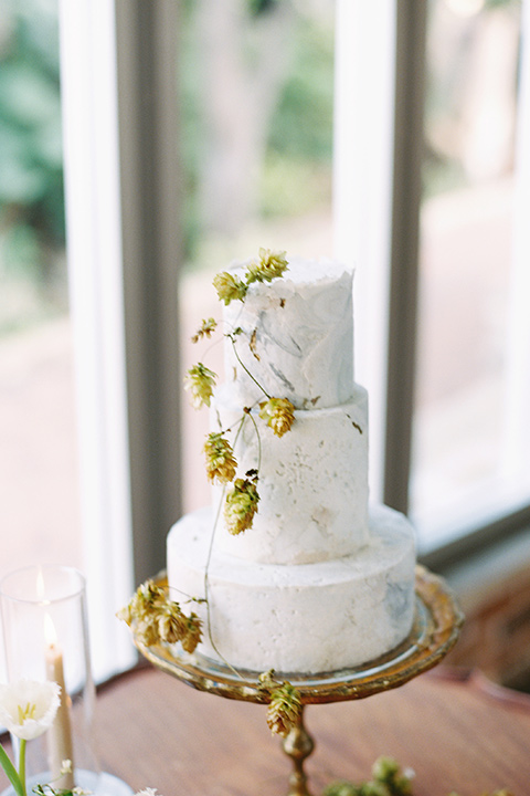  white cake with gold flower details