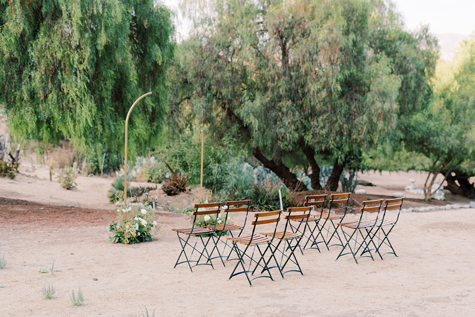  white table and table linens with sunset flowers 