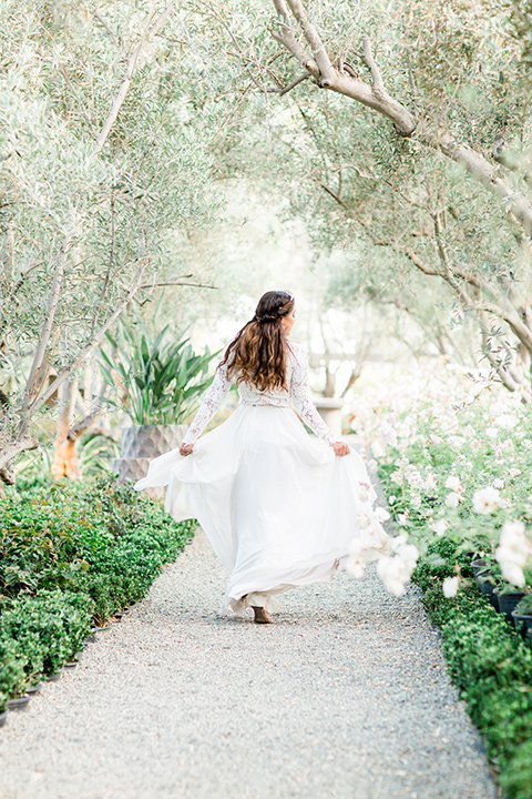  bride in a European inspired gown with lace details, a high neckline, and long sleeves 