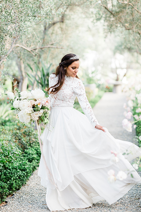  bride in a European inspired gown with lace details, a high neckline, and long sleeves 