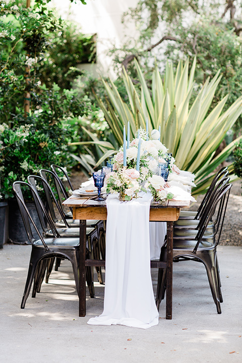  table linens with tall blue candles 