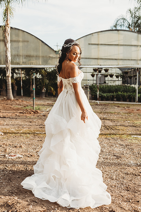  bride in a lace ballgown with off the shoulder neckline