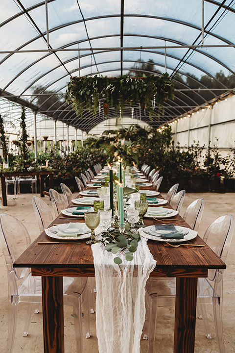  wooden farm tables inside the greenery room