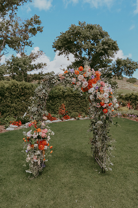  pink and orange floral ceremony arch 