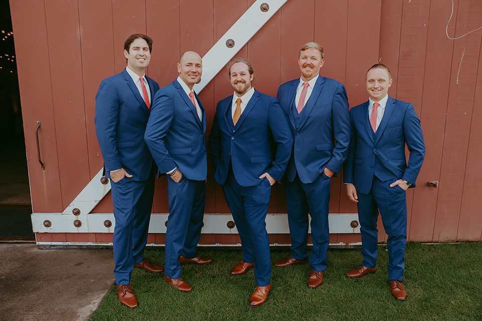  the groom in a cobalt blue suit for purchase and the groomsmen in rental cobalt suits 