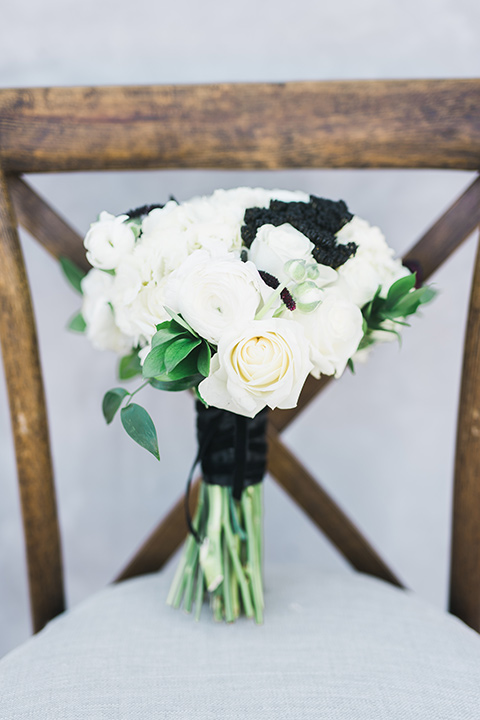 black and white flowers with a black ribbon 