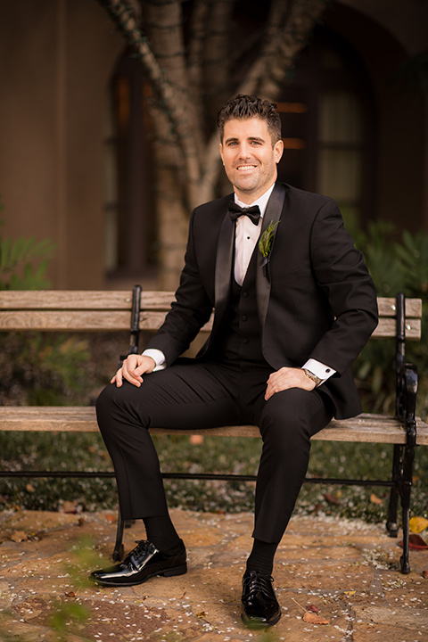  man in a black tuxedo with a shawl lapel tuxedo