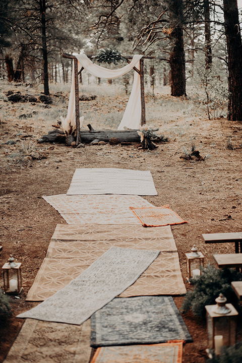  ceremony décor with bohemian rugs and pampas grass