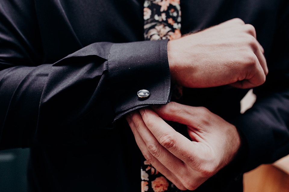  groom fixing his sleeve cufflink