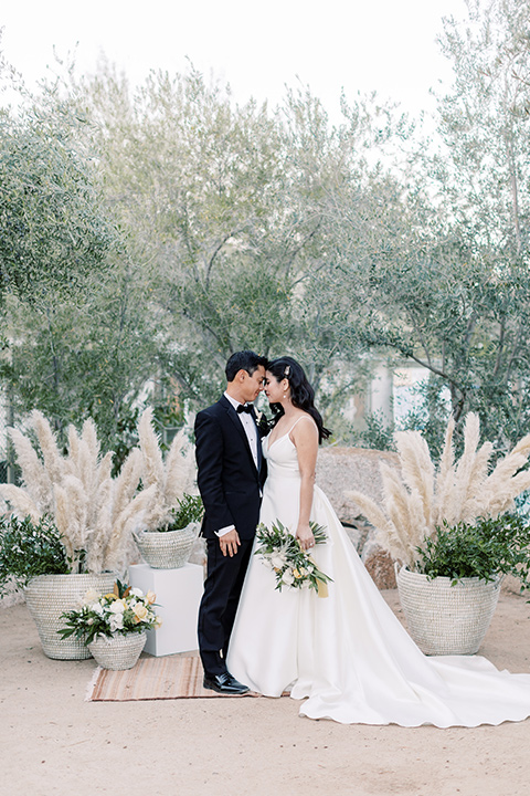  bride in a white modern ballgown with pockets and a low cut neckline