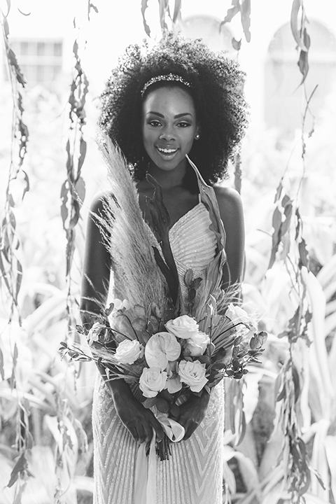  bride in a white lace formfitting gown with a V-neckline 