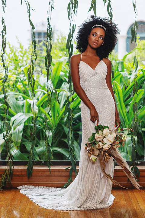  bride in a white lace formfitting gown with a V-neckline 