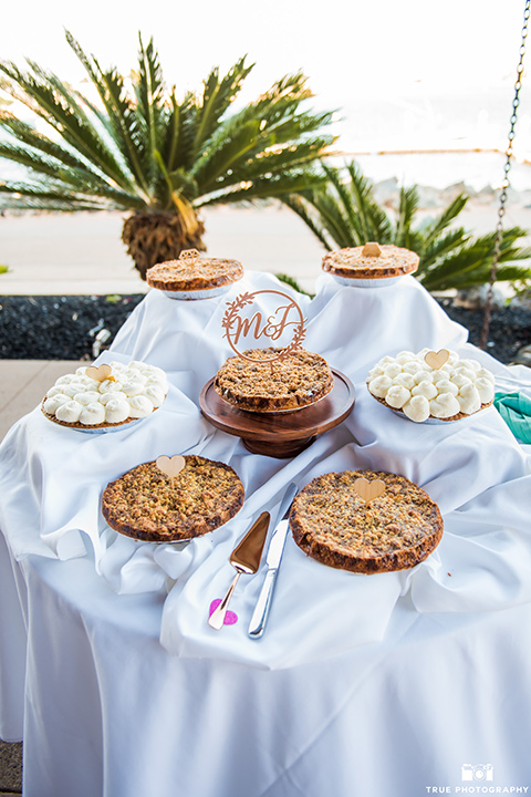 white table linens and desserts on table 