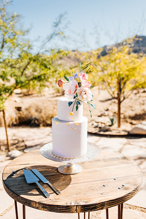  white layered cake with pink flowers 