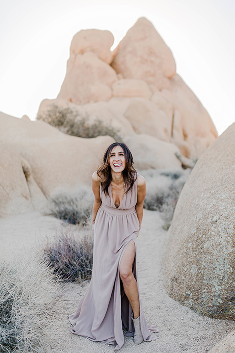 bride in a taupe maxi gown with straps and her hair down