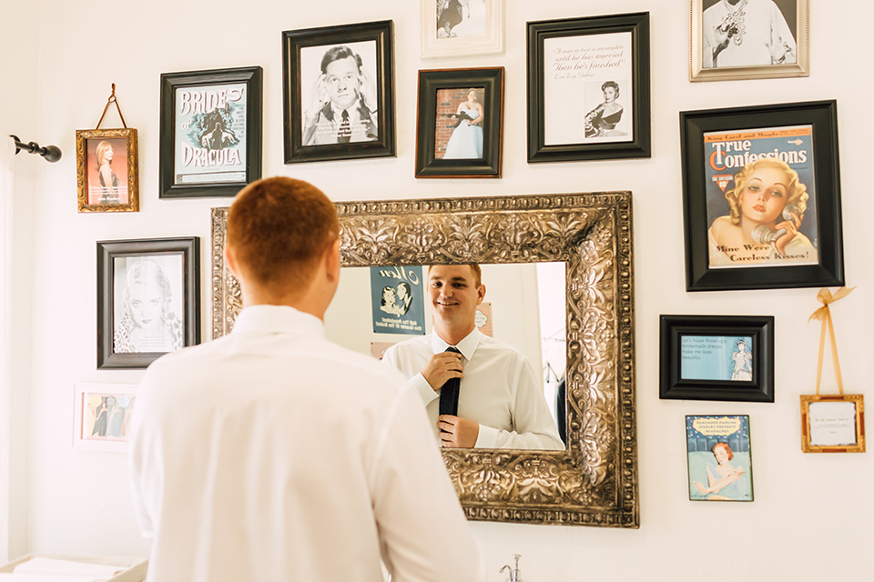 groom looking in the mirror