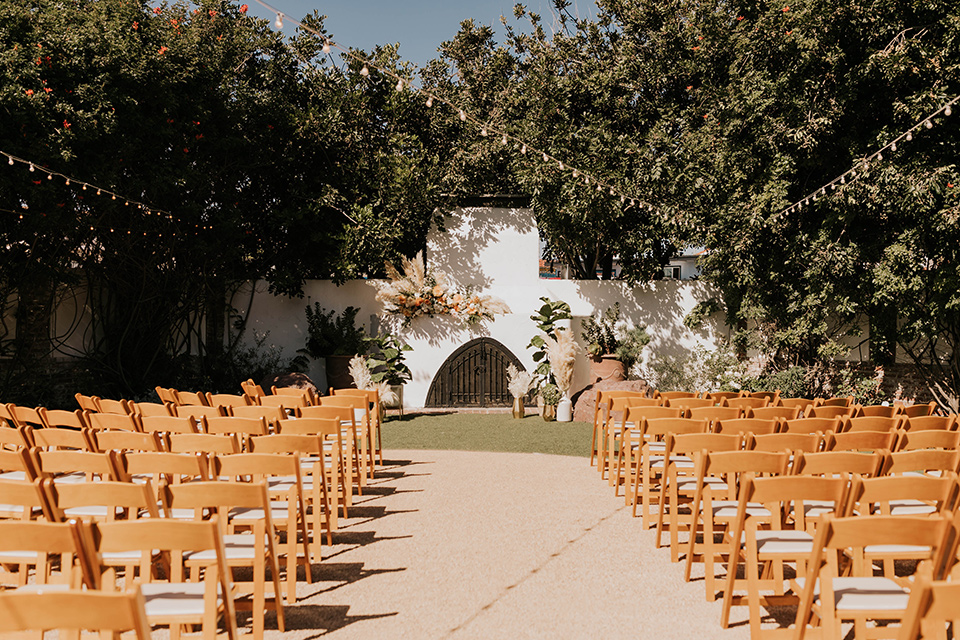  ceremony space with wooden chairs and fireplace