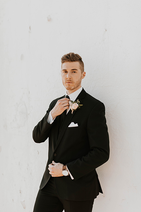  groom in a black suit 
