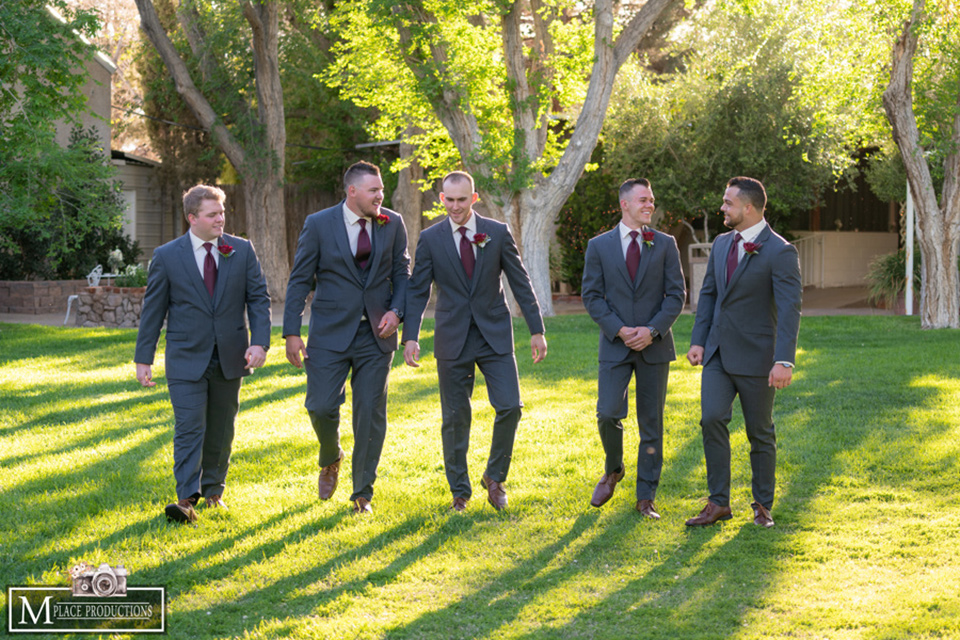  groom and groomsmen in charcoal grey suits 