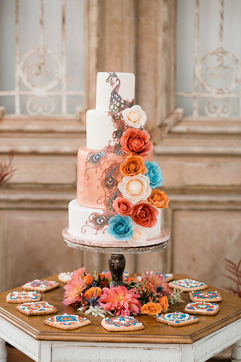  white cake with blue and orange floral details