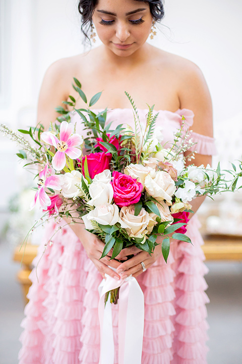  bride in a pink ballgown with ruffles 