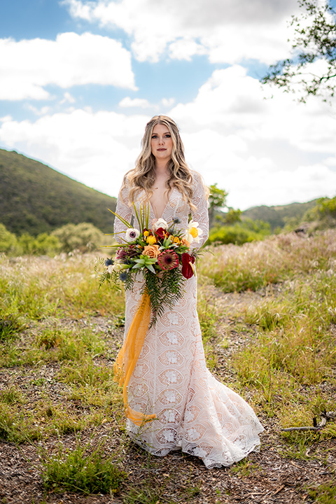  bride in a lace gown with long sleeves