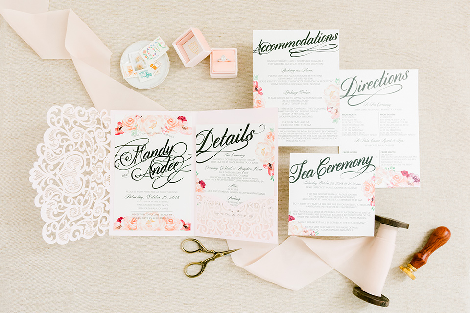  white invitations with floral decor 