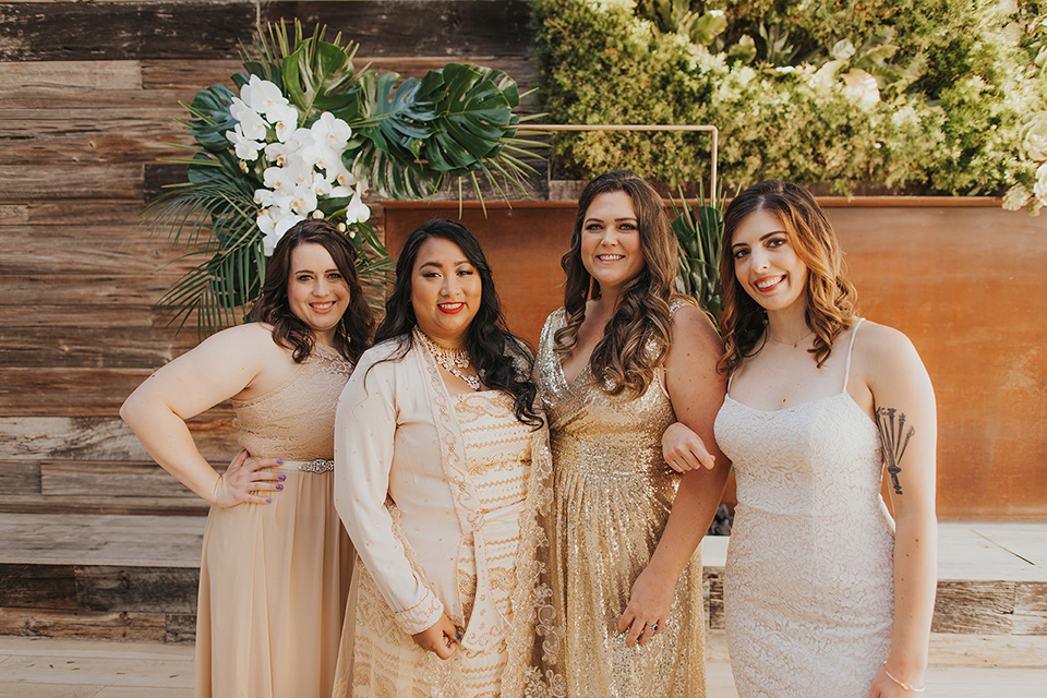  bride in a cultural Burmese gown, the bridesmaids in gold gowns 