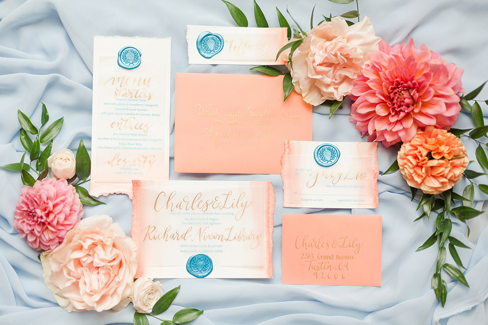 pastel colored invitations with calligraphy