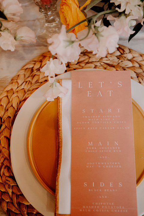  cream and terracotta colored plates and flatware 