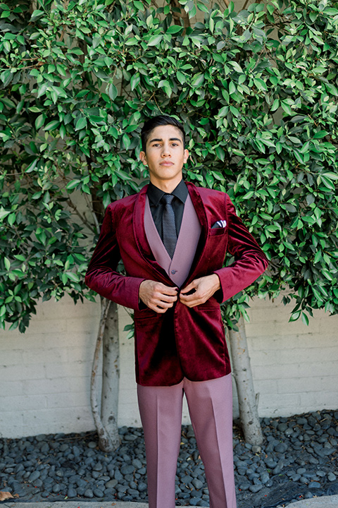  chambelanes style with a burgundy velvet tuxedo, rose pink pants and vest, and a black shirt 