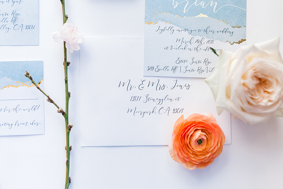  light blue invitations with flowers