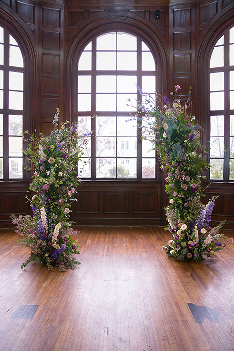  ceremony archway with purple and green flowers