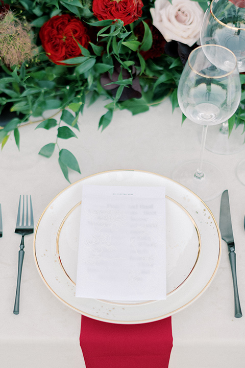  white plates and red linens