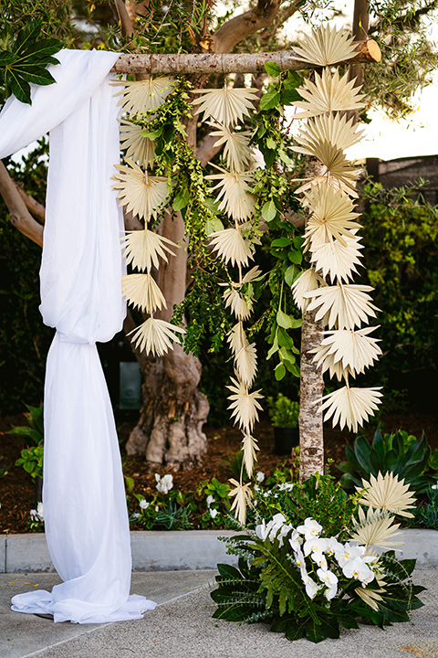 white linen detail on ceremony arch