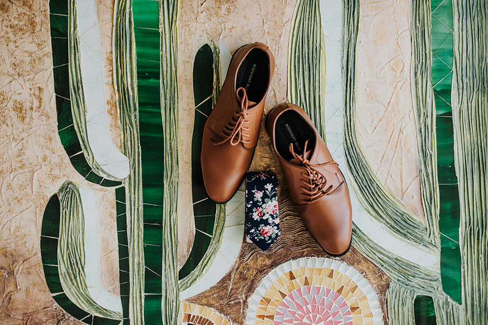  brown shoes on a fun tile decor