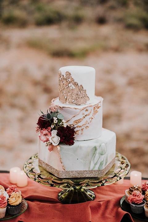 white cake with pink and red florals