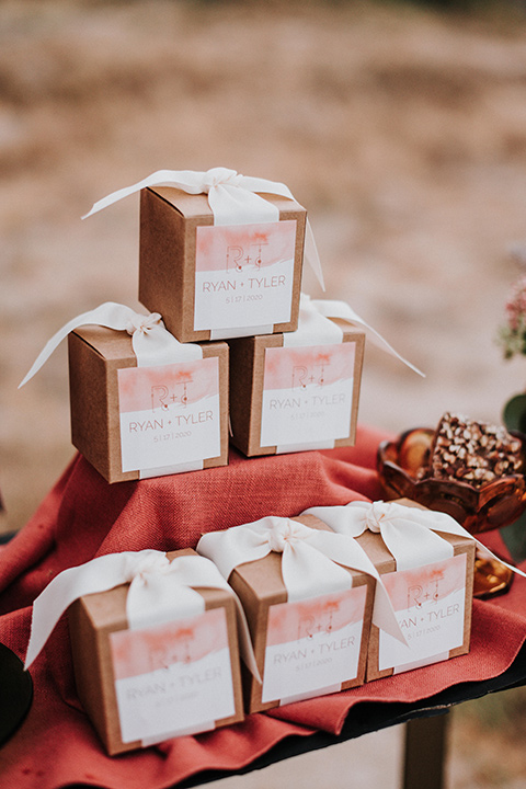 gift boxes with the grooms names on them