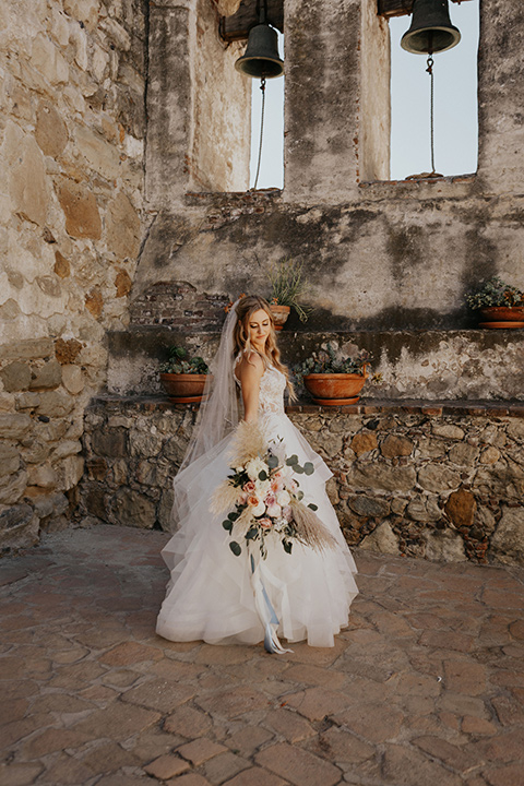 bride in a white ballgown and a lace bodice detailing