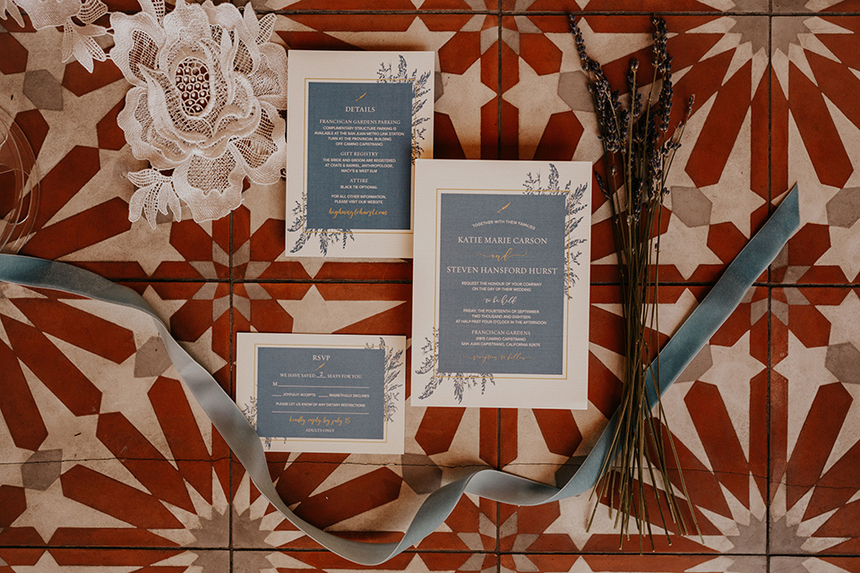  white and slate blue invitations and white calligraphy 