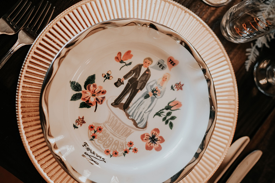  white plate with a bride and groom painted on them 
