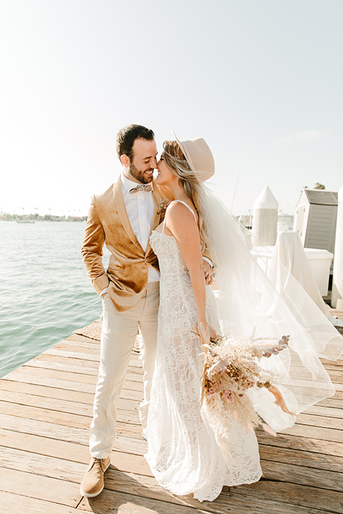  1970s golden hour boat elopement – embrace and kissing 